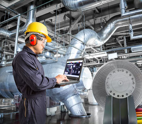 utility technician working on a laptop