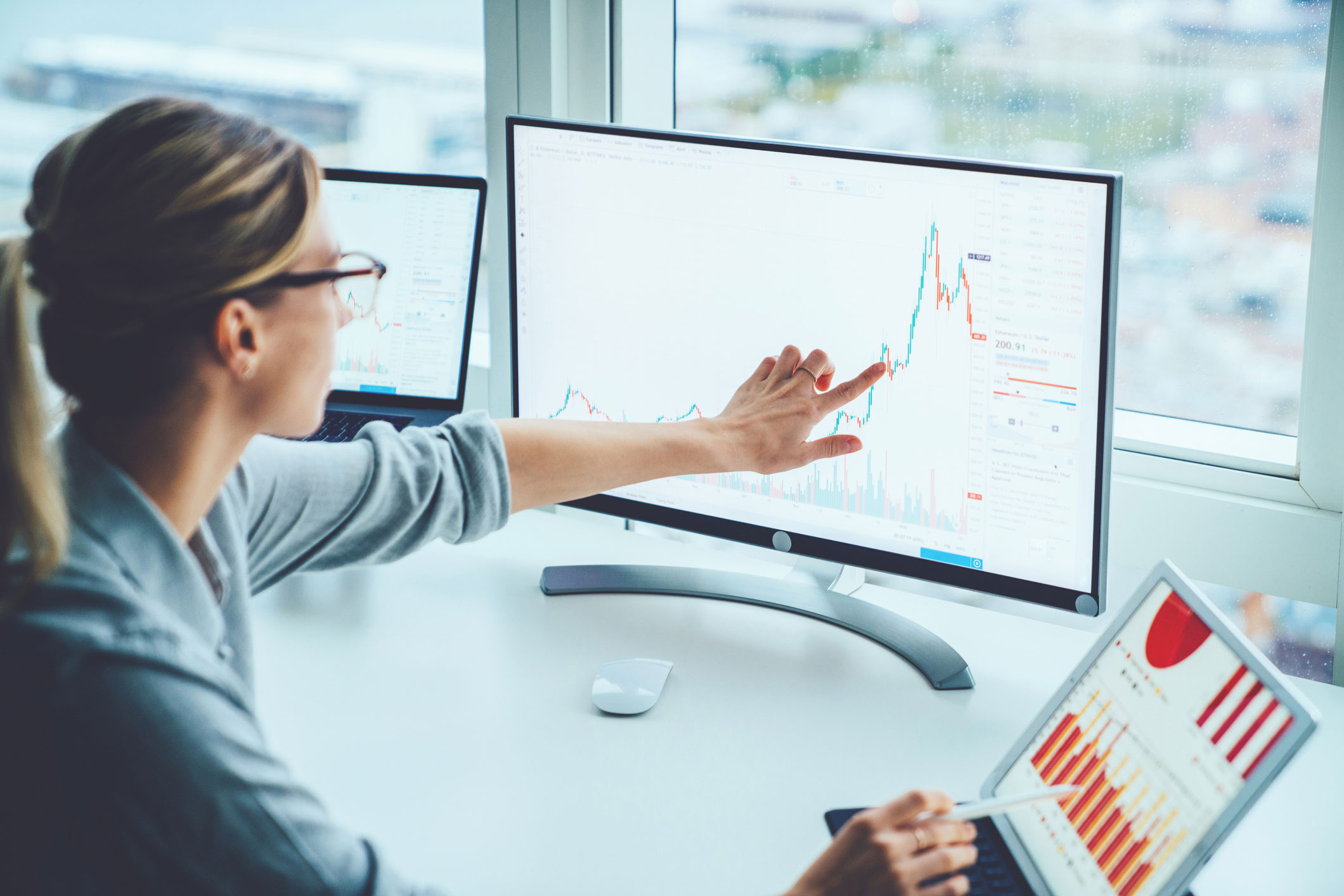 data scientist viewing data on a desktop computer