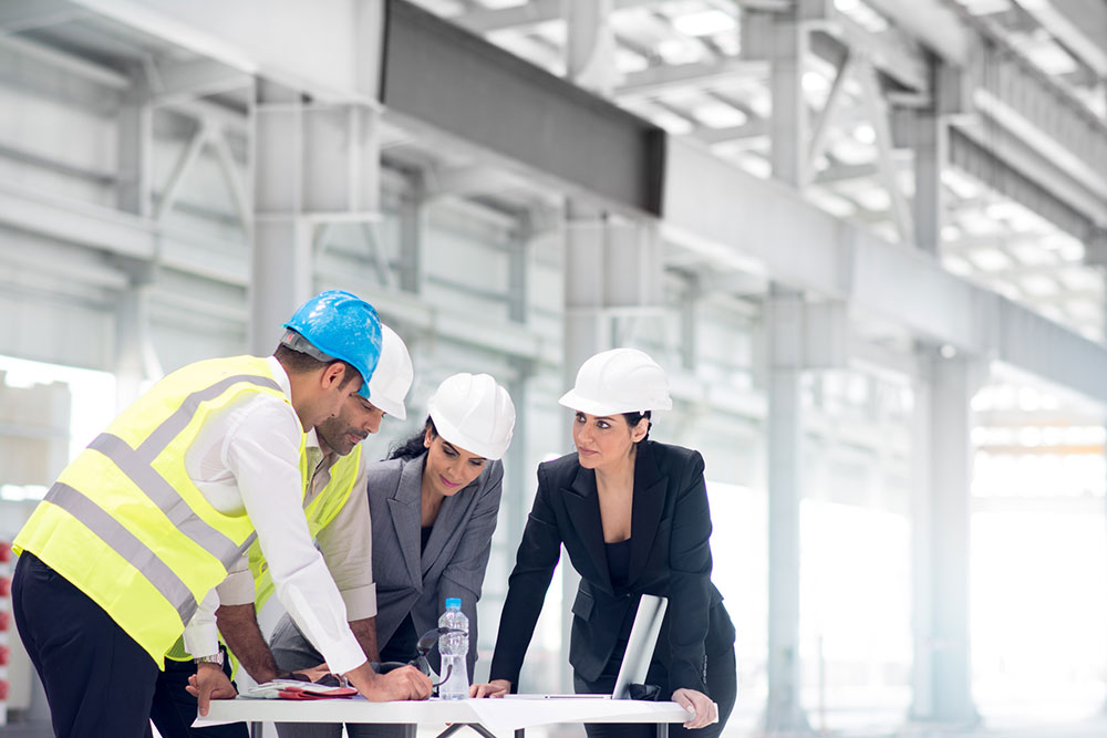 group of workers and a project manager collaborating at work