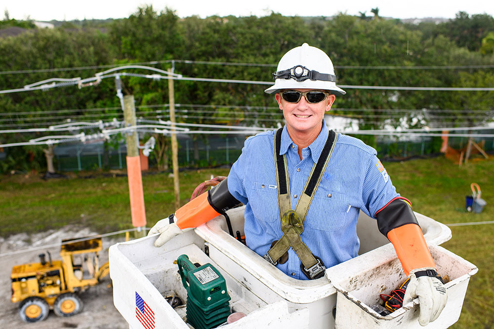 lineworker in a cherry picker